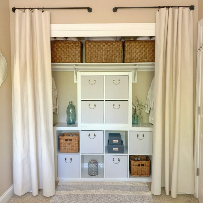Organized your closet with curtains and cube organizers
