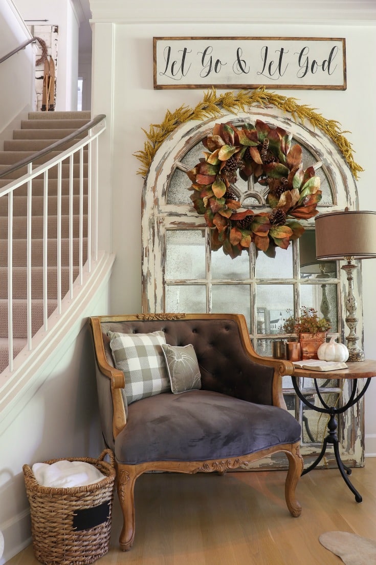 fall decor corner with reading chair and mirror