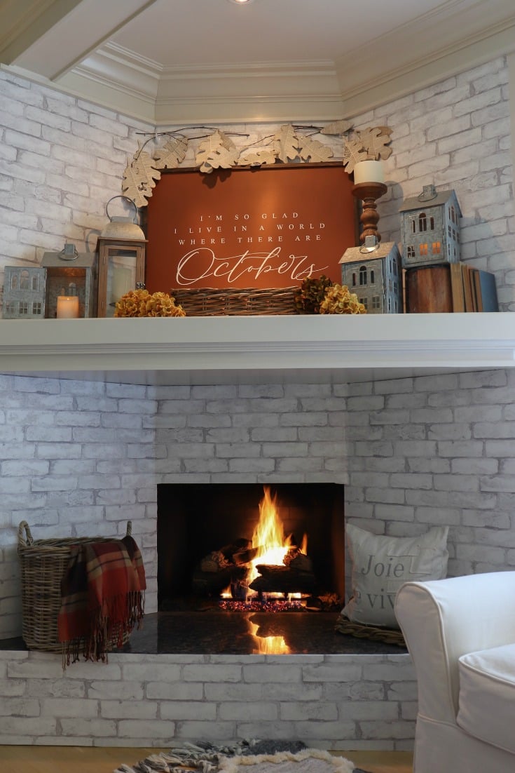 Warm colors and rich hues create a warm inviting fall fire place and cozy mantel decor