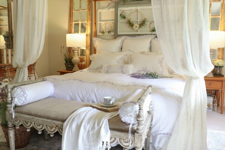 white farmhouse bed with cozy bedding for better sleep