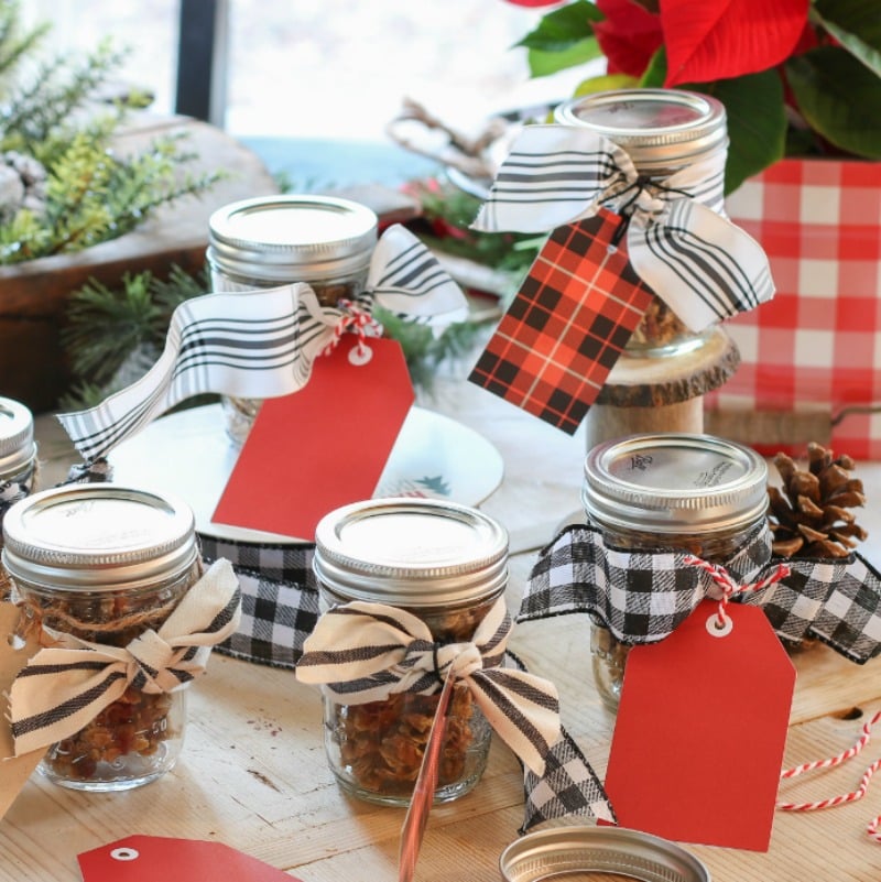 mason jars filled with homemade granola tied with festive ribbons are perfect Christmas gifts