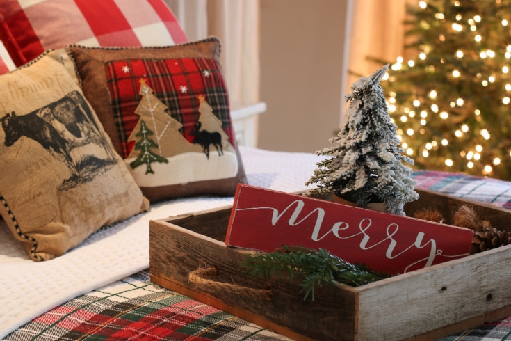 farmhouse christmas bed with red plaid bedding and rustic tray on top