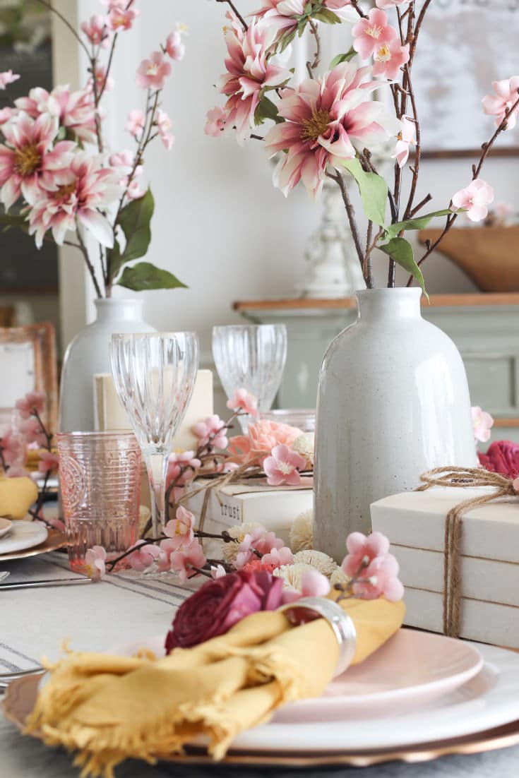 pink flowers with gold napkins on Valentine's Day table