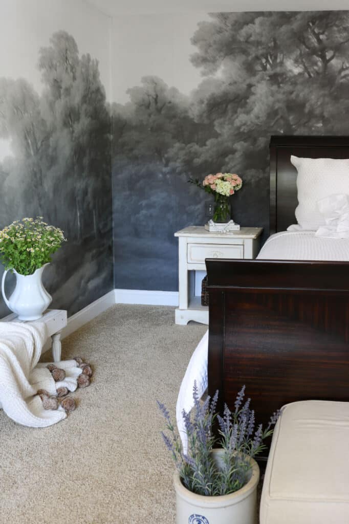 white bed with dark grey wall mural