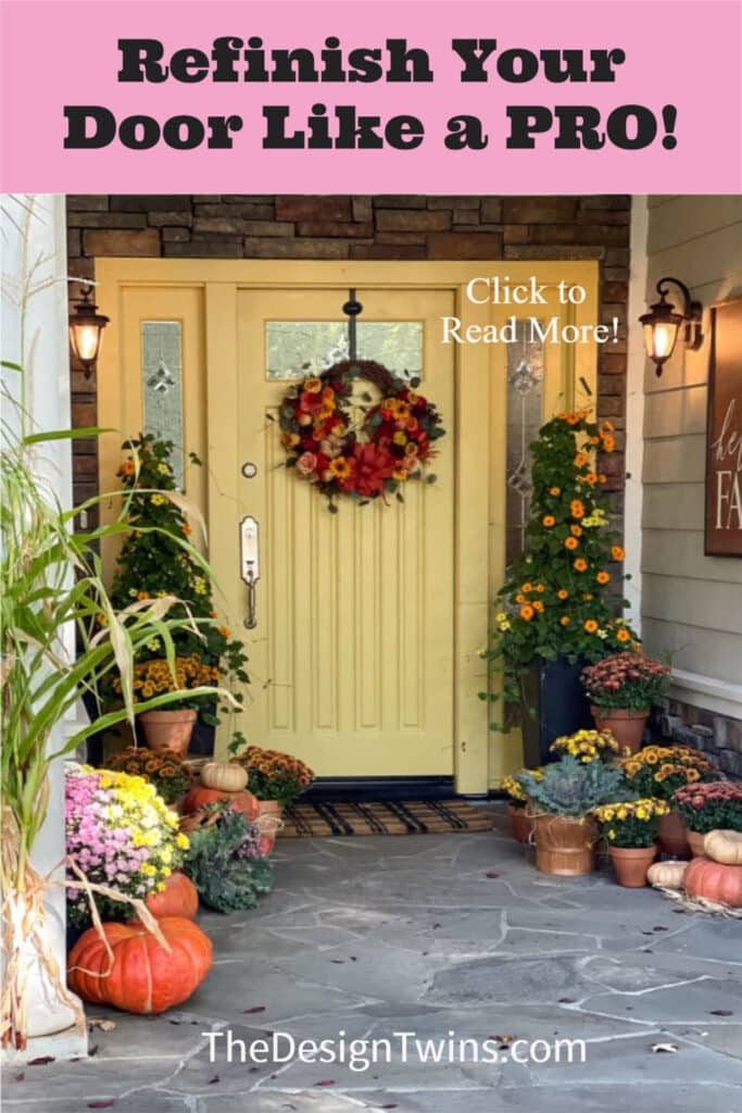 Beautiful gold painted front door decorated for fall with mums and pumpkins