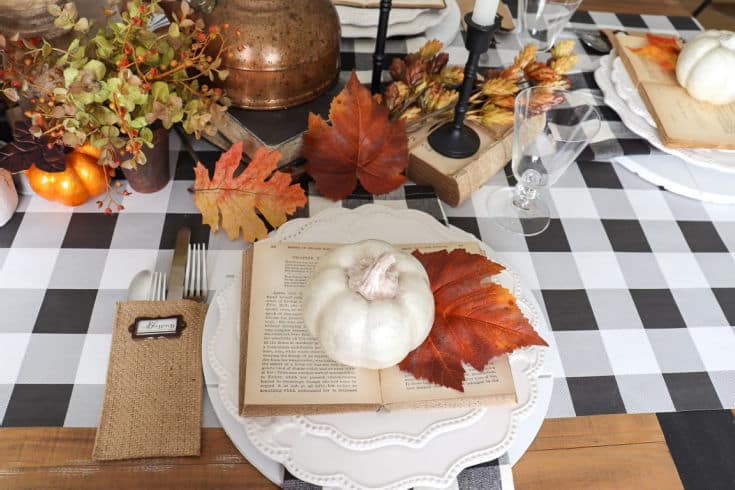 black and white buffalo plaid table runner with fall botanicals create festive tablescape