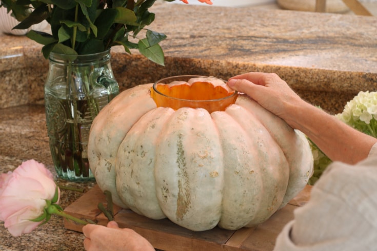 place a vase inside the pumpkin to use as floral vase