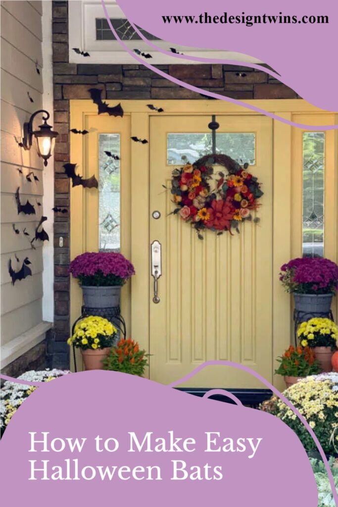 Front door and front porch decorated for fall with pumpkins mums and bats for Halloween