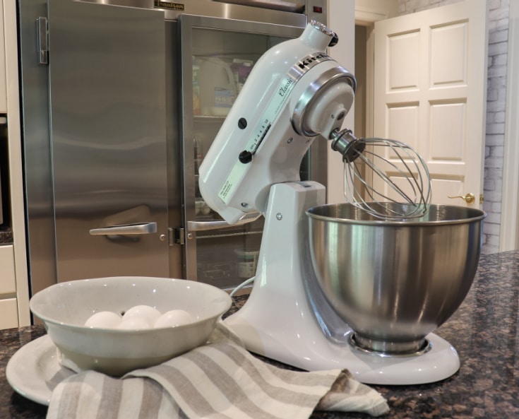 KitchenAid mixer is best Christmas gift shown on black granite island in modern kitchen