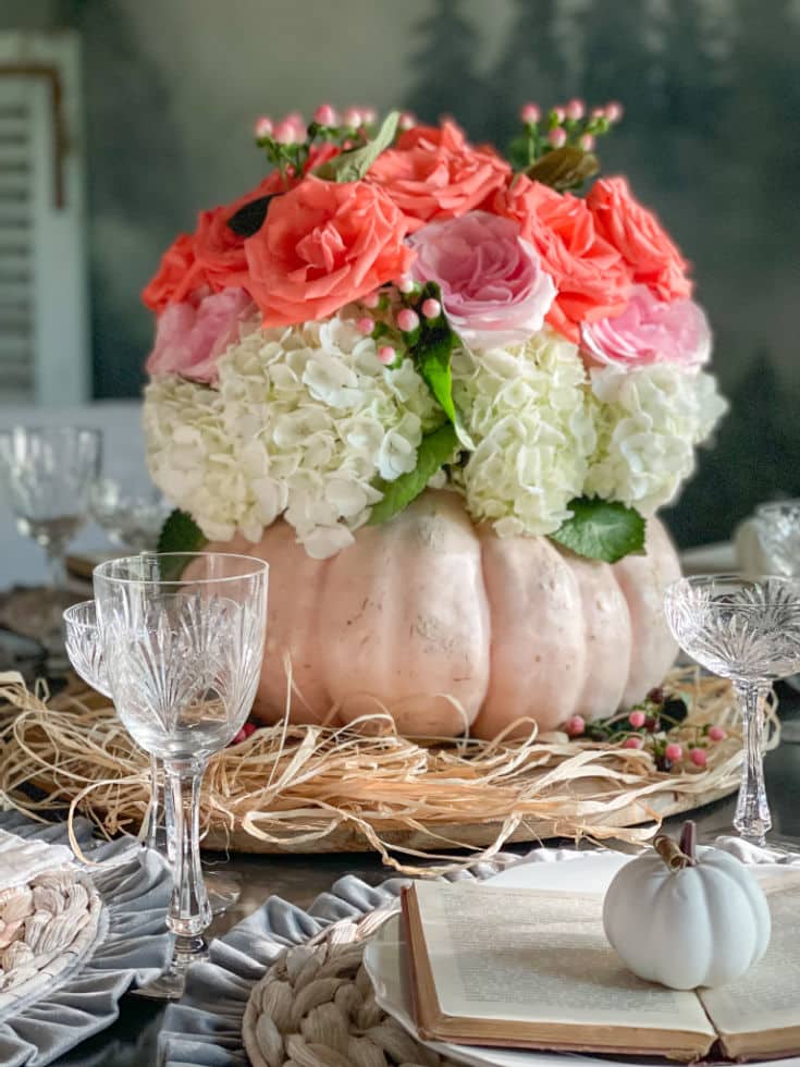 seasonal centerpiece with pumpkin vase and roses