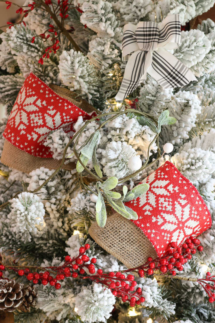 red snowflake ribbon decorates Christmas tree
