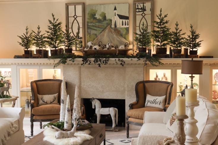 Christmas mantel decor with wool pompoms and stockings hung