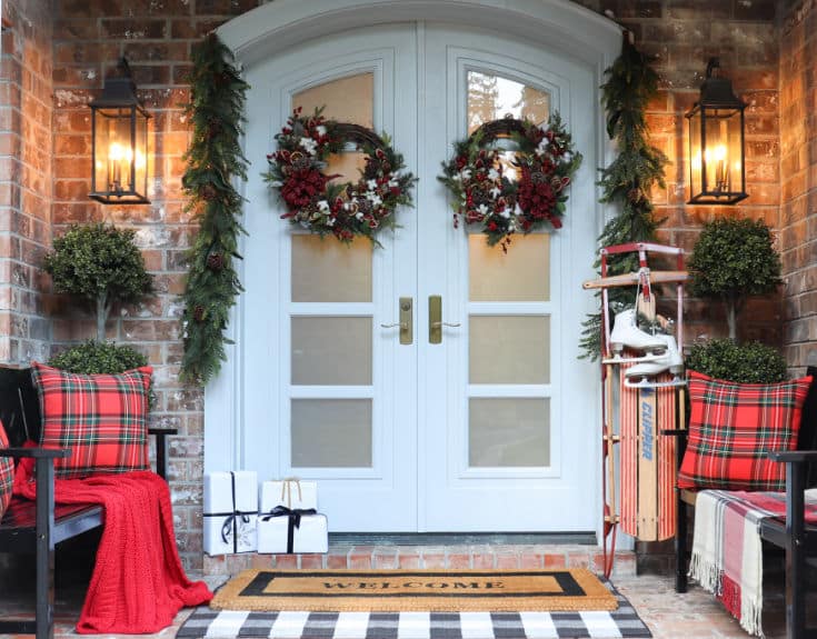 Christmas front porch decor is festive and easy with handmade wreaths and evergreen garland