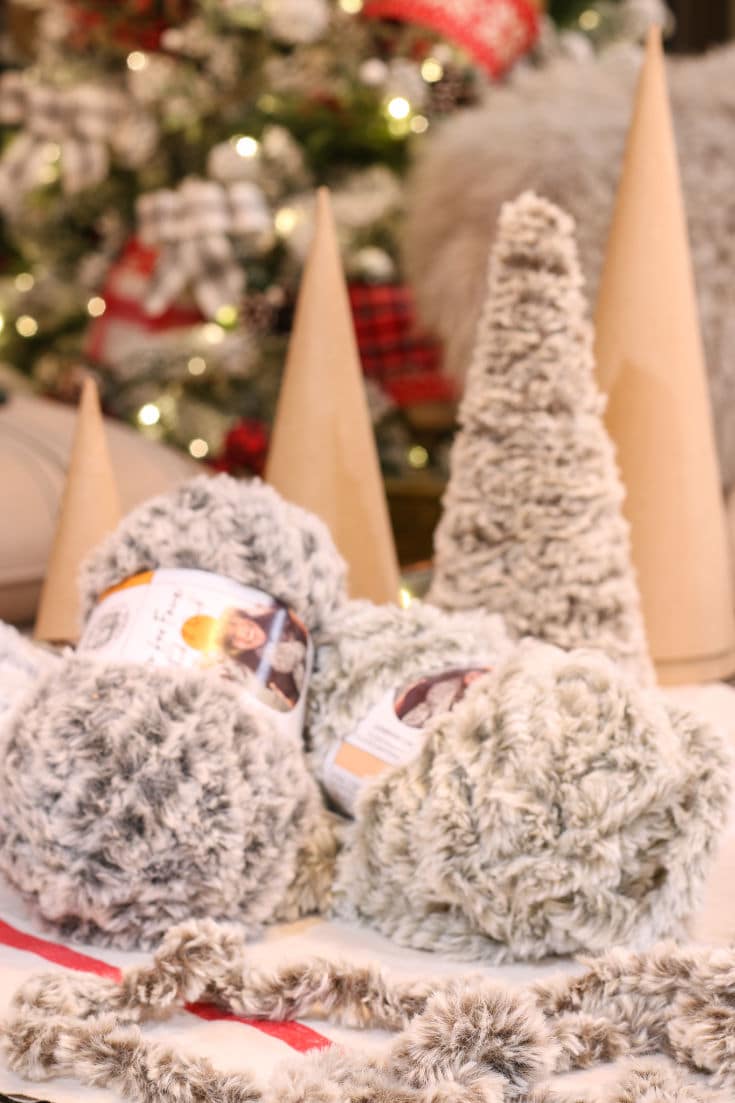 faux fur yarn in different shades and paper mache cones are supplies needed for mini Christmas tree project