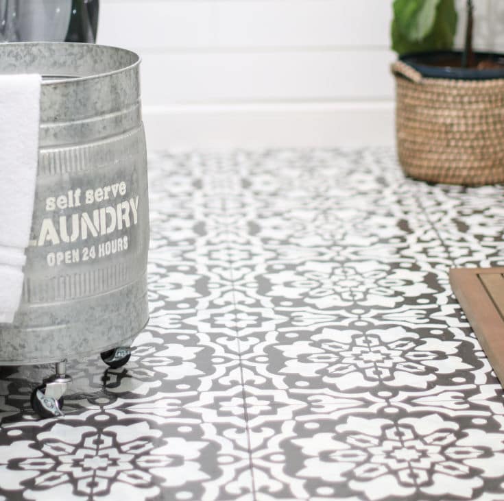 Beautiful black and white mosaic pattern stencils on laundry room floor