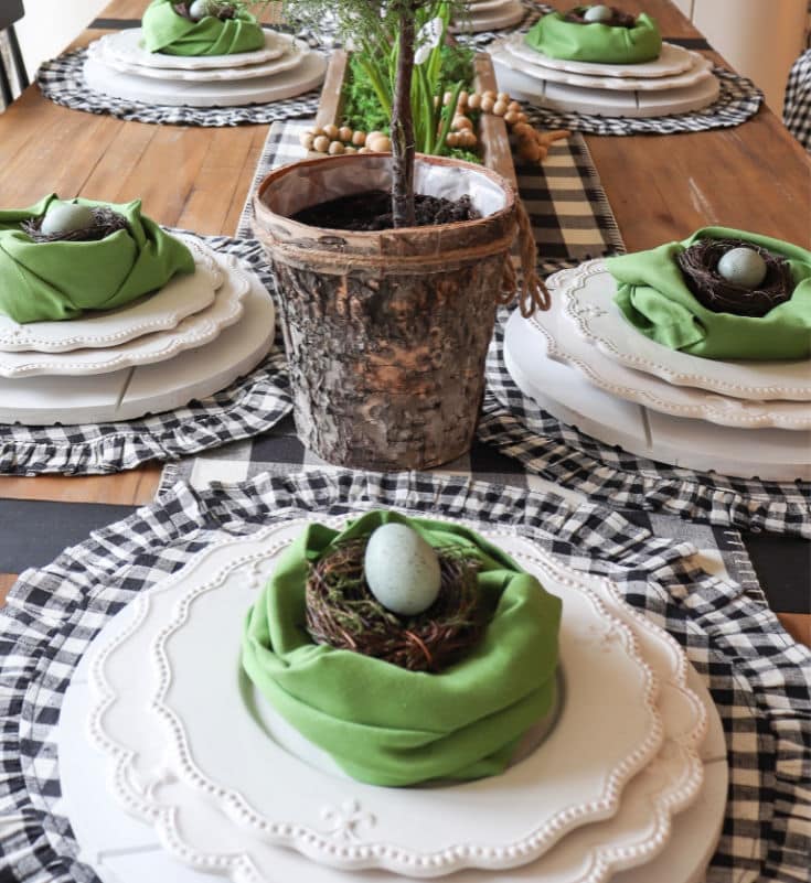 Green napkin nests are easy Easter decorations for place setting
