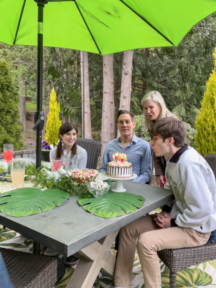 Backyard party is perfect place to celebrate birthday together under the new festive umbrella