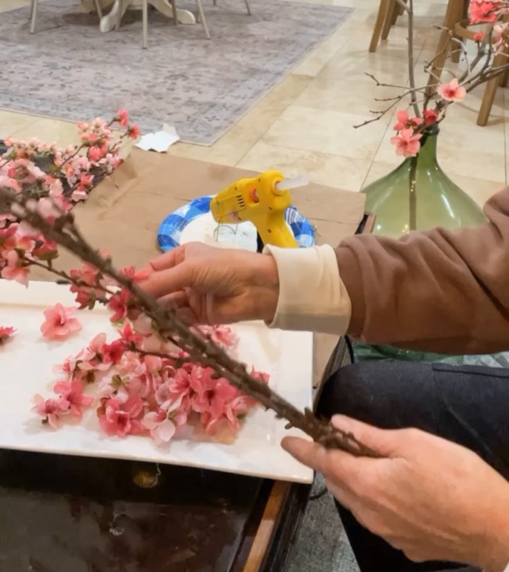 removing faux blossoms for DIY branches