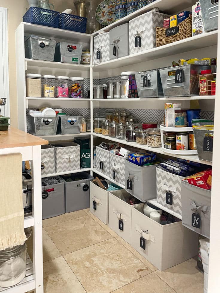 Before photo shows potential but also focuses on builder-grade shelves which are pantry's weakness.