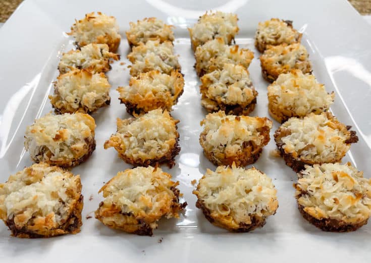Magic cookie bars made in a mini muffin pan. Vanilla wafers, topped with chocolate chips, butterscotch chips, walnuts, and coconut. Finished with sweetened condensed milk and baked until golden brown