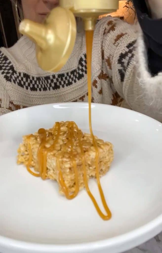 drizzling salted caramel on rice krispies squares