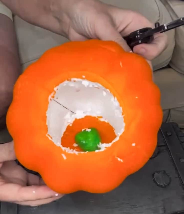 cut out hole in carve-able pumpkin to make yarn pumpkin