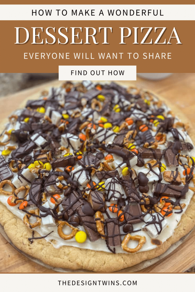 Jodie cutting a halloween dessert pizza. A close-up of a Dessert Pizza, showcasing a sugar cookie crust covered with a colorful array of leftover Halloween candy pieces and drizzled with milk chocolate.